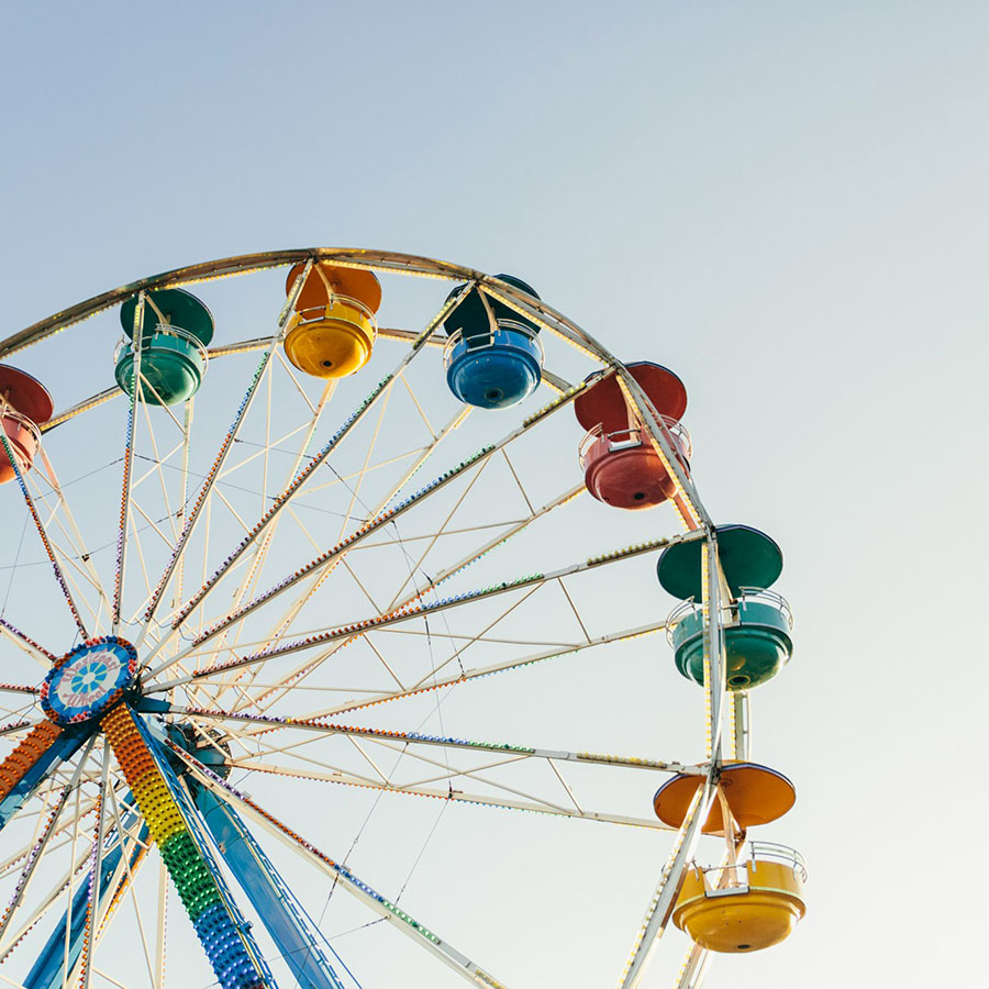 Colorful ferris wheel in the bright sunlight.