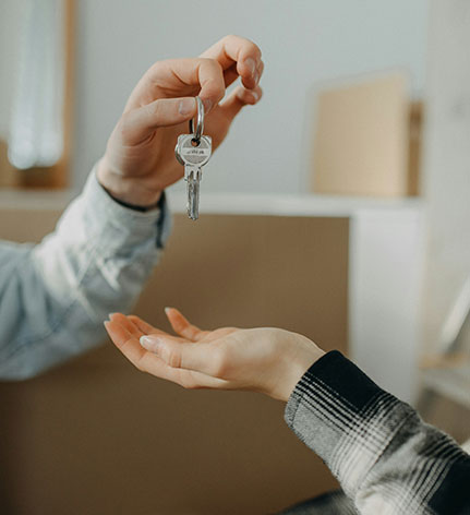 Landlord giving house keys to new resident.