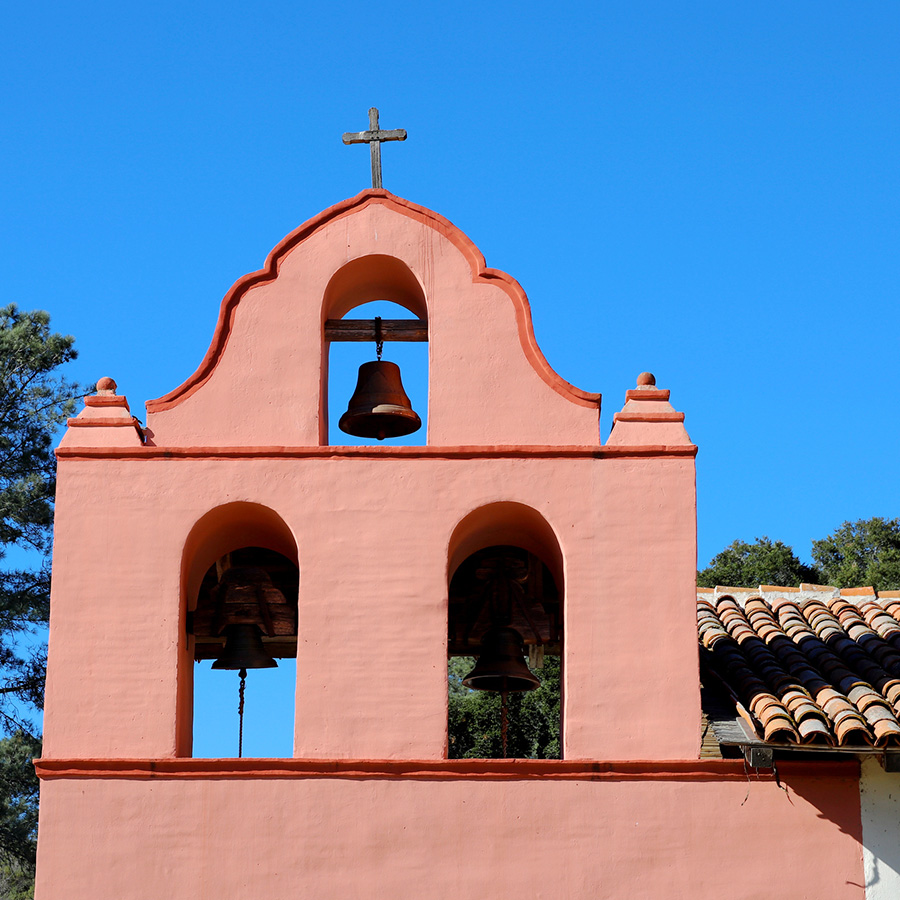 La Purísima Mission with tile roof and bell tower.