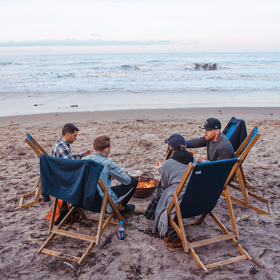 Group gathering for an ocean bonfire at Ocean Park.