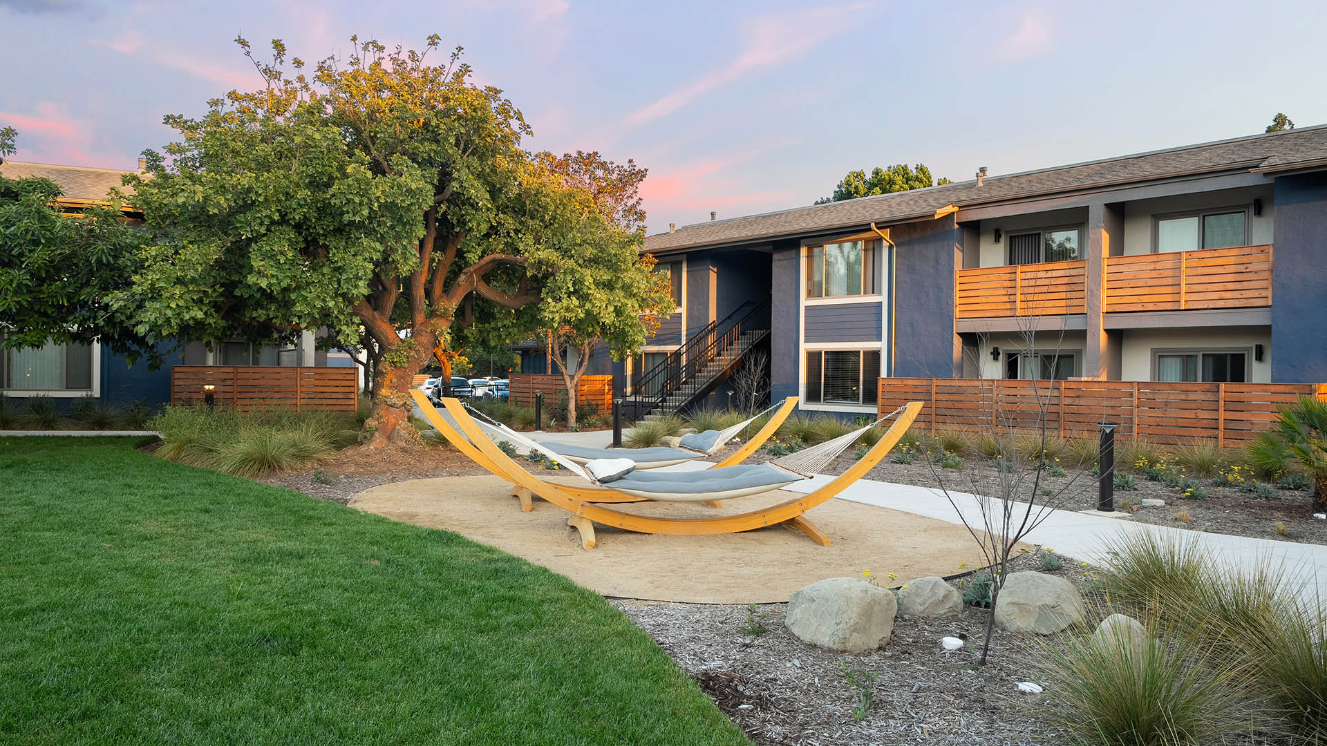 Patterson Place outdoor courtyard with hammocks and lush green lawns.