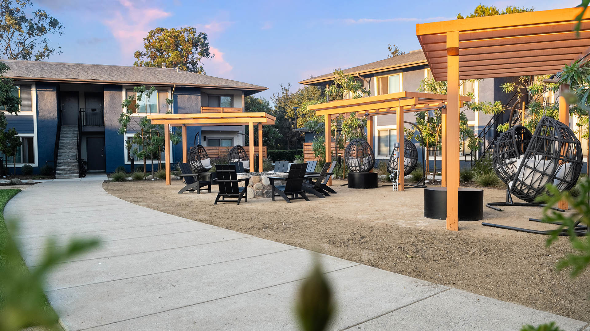 Patterson Place outdoor courtyard with pergolas and comfortable seating.