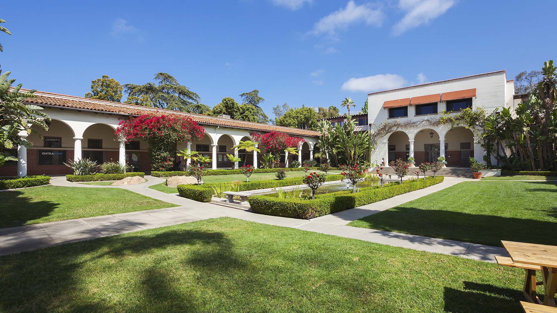 Riviera Park commercial property with lush landscaping and classic architecture.