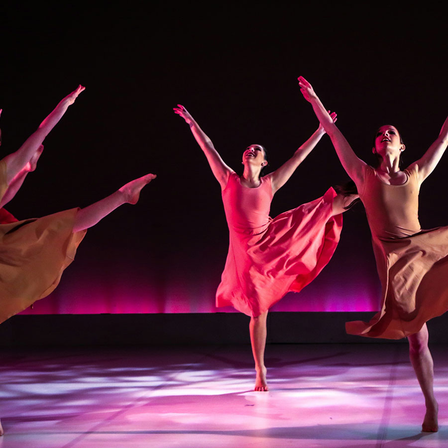 Dancers on stage performing.